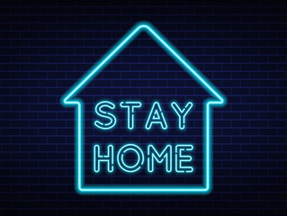  Stay Home neon sign quarantine coronavirus epidemic. Bright night neon sign against the background of a brick wall with illumination. Protection campaign or measure from coronavirus, COVID-19.