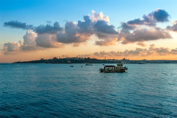 Naklejka premium Istanbul, Turkey, 11 June 2006: Fishing Boat, Sunset