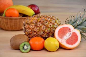 still life different tropical fresh fruits on a wooden table