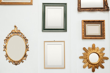Golden frames on a wall mockup