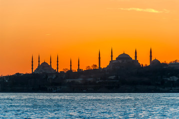 Naklejka premium Istanbul, Turkey, 23 January 2012: Blue Mosque, Hagia Sophia Museum, Historical Peninsula, Sunset