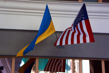 two flags hang side by side