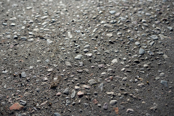 Closeup of a sandy road with little stones.