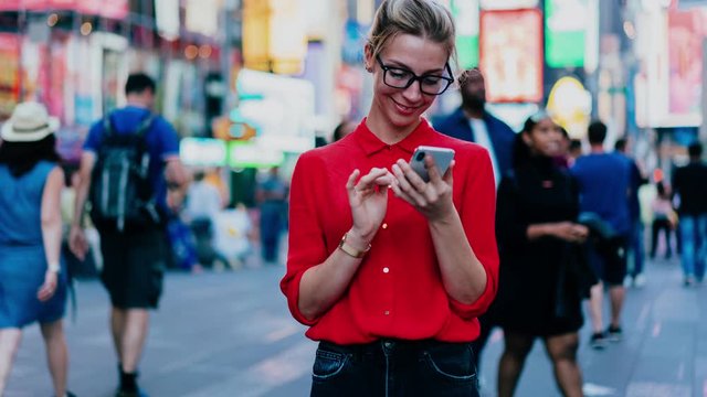 Zoom in on millennial hipster girl with digital technology using public internet connection for virtual messaging with unreal friends, concept of pda dependence in metropolitan downtown

