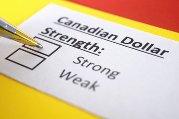 Fototapeta premium One person is answering question about strength of Canadian dollar.