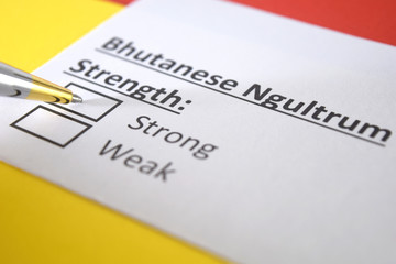Obraz premium One person is answering question about strength of Bhutanese Ngultrum currency.