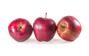 A set of three fresh red apples with drops isolated on white background