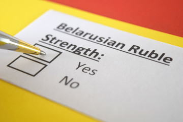 Fototapeta premium One person is answering question about strength of Belarusian Ruble.