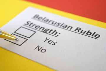 Fototapeta premium One person is answering question about strength of Belarusian Ruble.