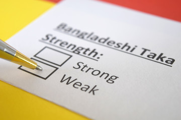 One person is answering question about strength of Bangladeshi Taka.