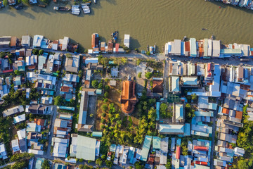 Obraz premium Aerial view of the famous Cai Be church in the Mekong Delta, Roman architectural style. In front is Cai Be floating market, Tien Giang, Vietnam