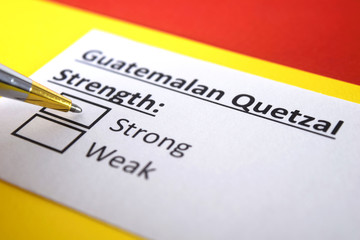 One person is answering question about strength of Guatemalan Quetzal Currency.