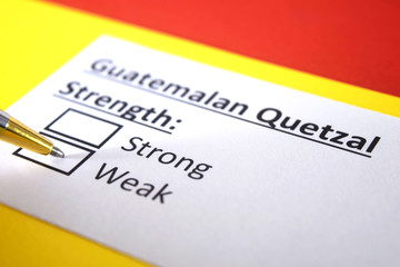 One person is answering question about strength of Guatemalan Quetzal Currency.