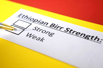 Fototapeta premium One person is answering question about strength of ethiopian, birr