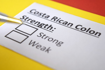 Obraz premium One person is answering question about strength of Costa Rican Colon.