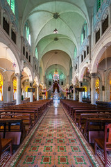 Fototapeta premium Aerial view of the famous Cai Be church in the Mekong Delta, Roman architectural style. In front is Cai Be floating market, Tien Giang, Vietnam
