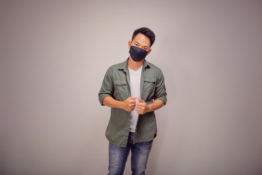 Vintage version of An Asian short hair man wears black mask.