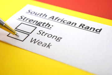 Fototapeta premium One person is answering question about strength of South African Rand.