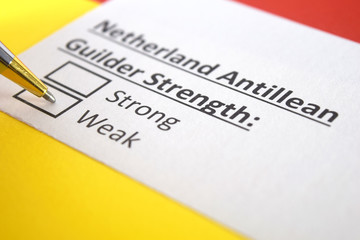 One person is answering question about strength of Netherland Antillean Guilder.