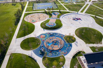 High aerial view of park with playground and splash pad closed for coronavirus