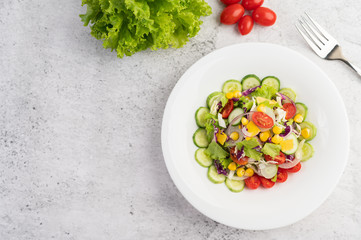 Vegetable salad with boiled eggs in a white dish.