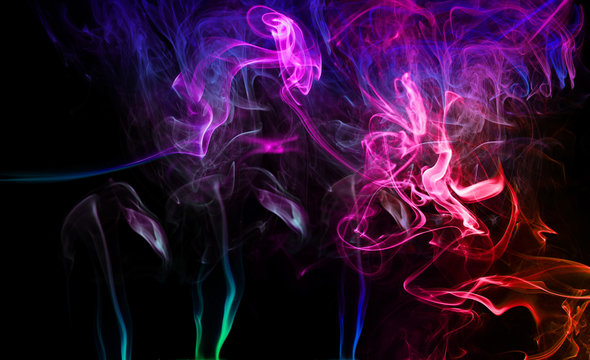 Close-up Of Colorful Smoke Against Black Background