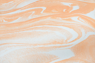 Fototapeta na wymiar Fluid marble texture in orange