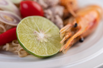 Mama and shrimp on a white plate.