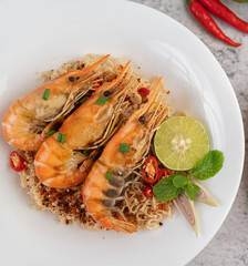 Mama and shrimp on a white plate.