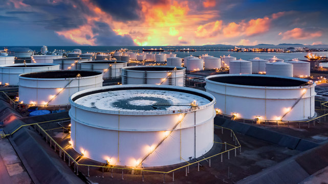 Storage of chemical products like oil, petrol, gas, Aerial view oil storage tank terminal and tanker, petrol industrial zone, Business commercial trade fuel and energy transport by tanker vessel.