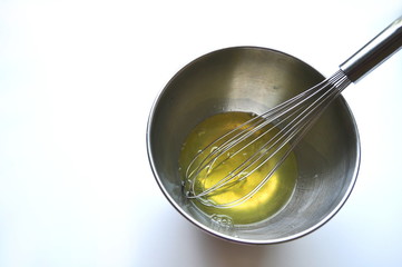 Recipe sequence - mini fruit sponge cakes - baking preparation.  Mixing eggs, yolks, flour and fruit into a liquid batter