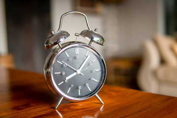 Alarm clock on table. Start work concept.