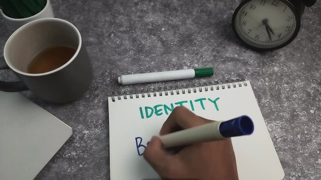 A young man writen Identity Branding. 4k Resolution
