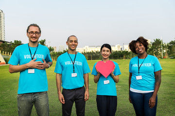 Group of happy and diverse volunteers