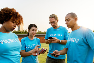 Volunteers posting on social media - Powered by Adobe