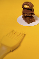 brown chocolate with yellow cream and brush