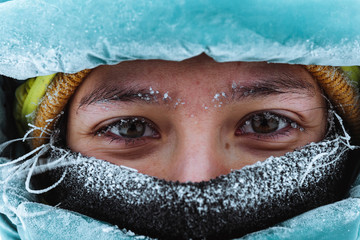 Closeup of a female mountaineer in wintertime at Glen Coe, Scotland