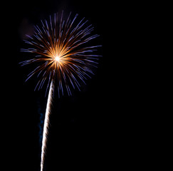 Blue pistil firework exploding with copy space