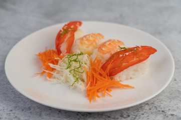 Sushi is beautifully arranged on the plate.