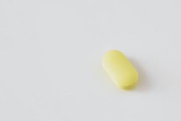 Yellow antibiotics on a white background