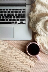 A laptop and a cup of coffee.