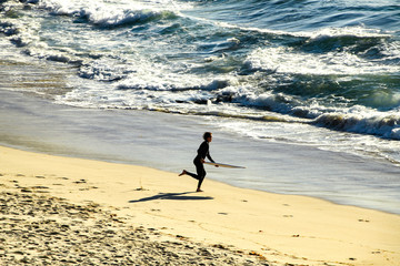 Running into the Surf to Skimboard