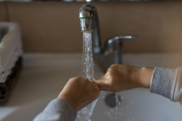 The boy washes his hands correctly. How to wash your hands correctly. Hand washing . Coronavirus