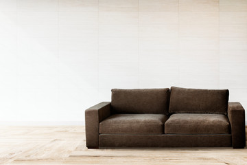 Sofa by a tiled wall