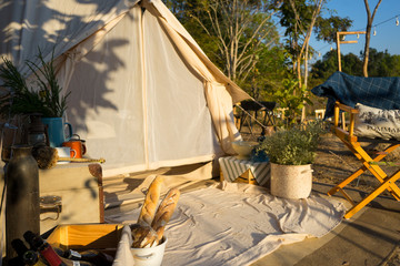 Camping tent and picnic table in the mountains.