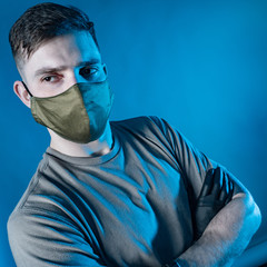 Portrait of a man in a protective mask and rubber gloves. Security measures during an epidemic of...