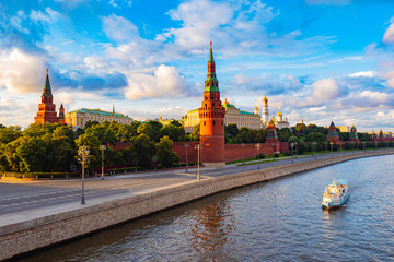 Obraz premium Moscow. Russia. View of the Moscow Kremlin from the Moscow river. Red brick towers. Grand Kremlin palace. Water trip to the capital of Russia. Bell Tower Of Ivan The Great.