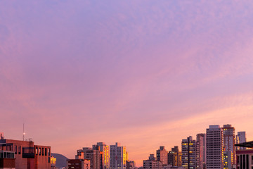 purple sunset over city