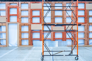 Repairs in the room. Installation of non-capital wall. Device for working at height. Construction hoist. Renovation works in the building.