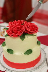 wedding cake with roses and ribbon